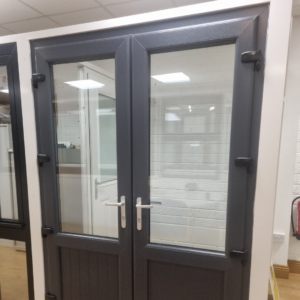 Modern anthracite grey PVC French door with double or triple glazing, featuring high-security locking and a sleek, energy-efficient design