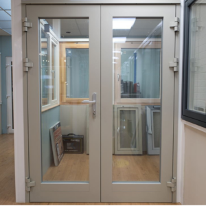 High-security triple-glazed AluClad French door with a durable aluminium exterior and elegant wood interior, offering energy efficiency and style.